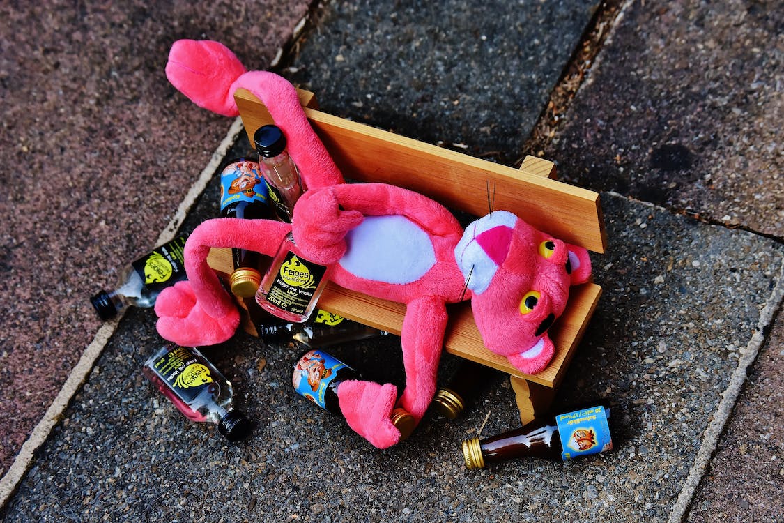 Free Pink Panther Plush Toy on Brown Bench Miniature Stock Photo