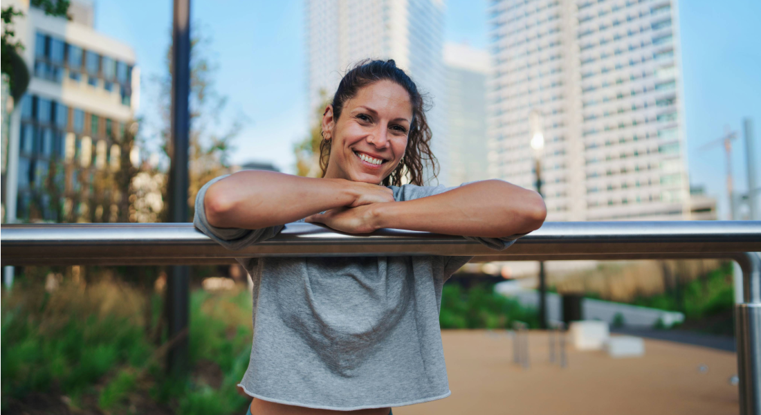 portrait shot of a woman leaning on a railing
