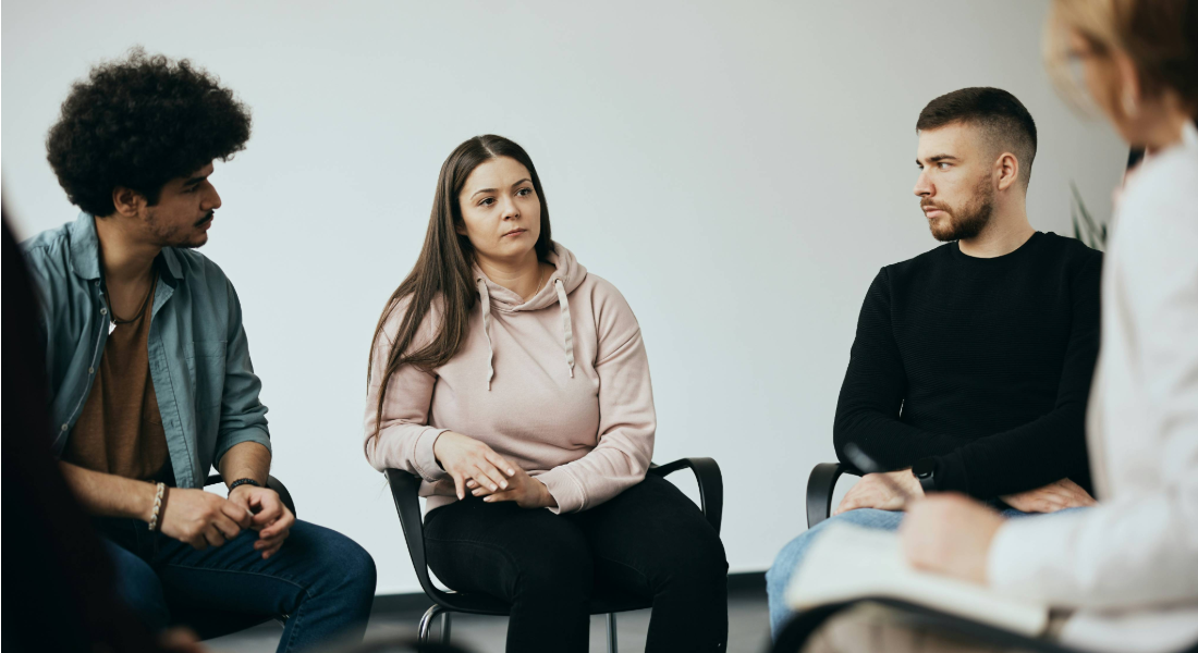 group of adults in a therapy circle