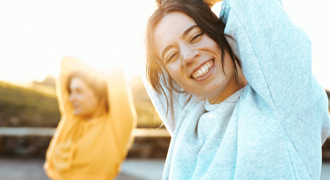 two women stretching