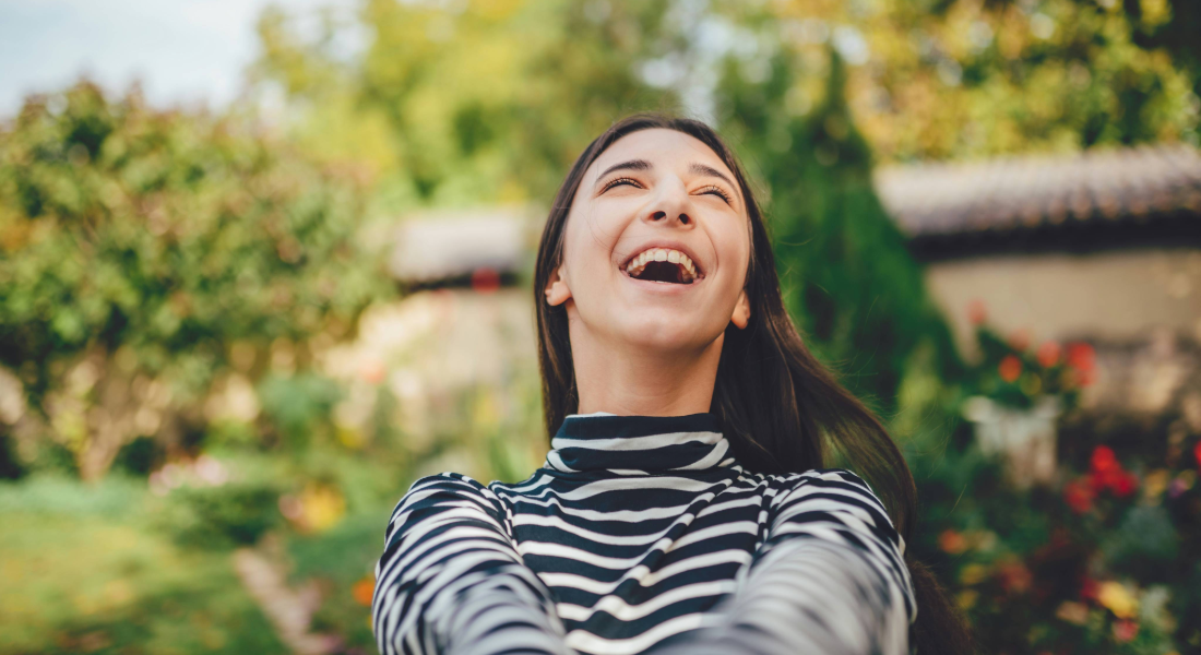 young woman looking up into the sky